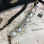 Chanel Pearl logo strap Flap Bag Black